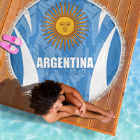 Round Argentina blue and white beach blanket with sun emblem and fringe edge