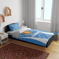 Blue and white Argentina bedding set with sun emblem, flag stripes, and matching pillows