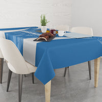 Blue Argentina-themed tablecloth with diagonal texture, neatly draped over a square table.