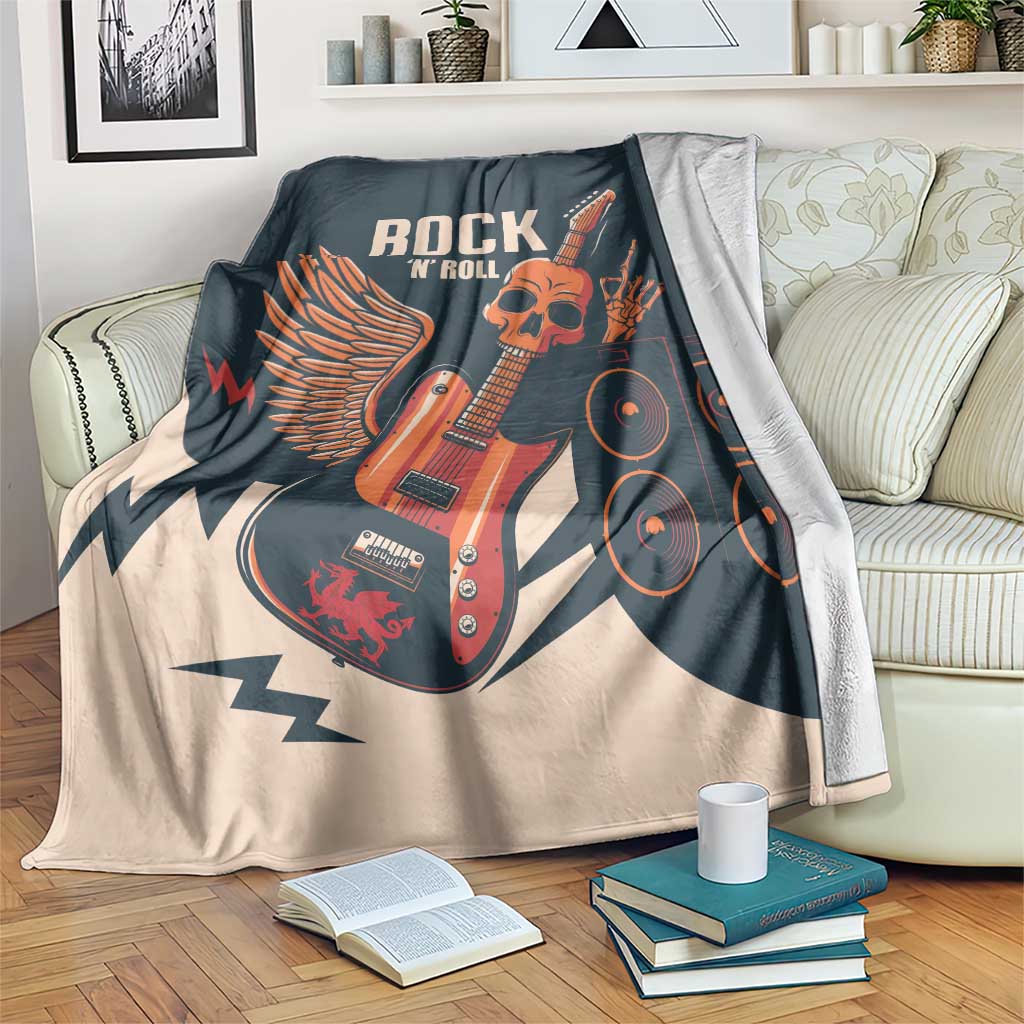 Rock skull guitar blanket spread on couch, dark teal and beige with skull guitar and amps graphic