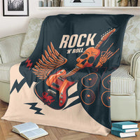 Rock skull guitar blanket on couch, dark teal and beige with ROCK N ROLL skull guitar design