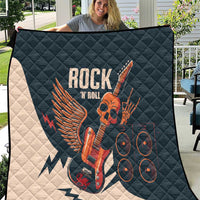 Rock and Roll skull guitar quilt held outdoors, dark teal quilted fabric with skull guitar graphic