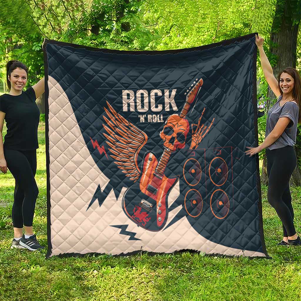 Rock and Roll skull guitar quilt spread on grass, dark teal with white lightning wing art
