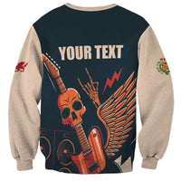 Unisex dark teal sweatshirt back with skull, guitar wings and editable text; beige sleeves