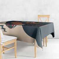 Skull guitar tablecloth draped over table edge, dark teal and beige print