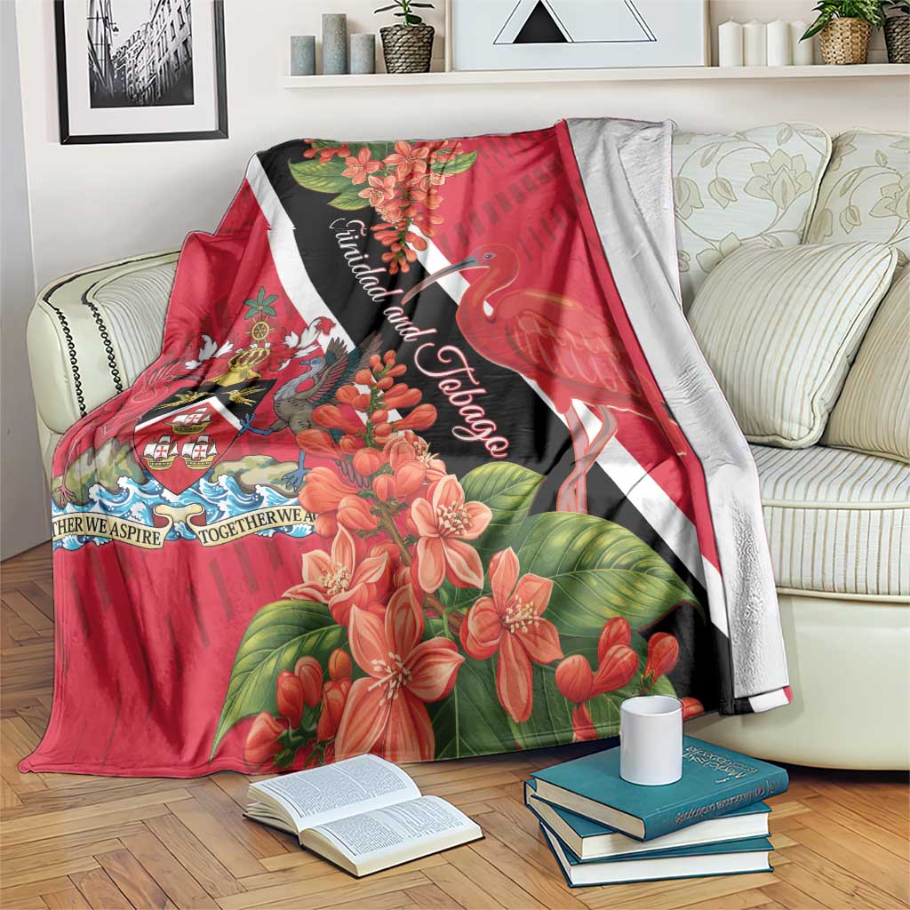 Red tropical blanket with Trinidad flag accents, bird, and blooming floral design