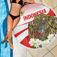 Round beach blanket with fringe and Indonesia lion-and-eagle print, white flowers and red stripe