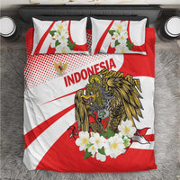 Red and white bedding set close-up: eagle emblem, “Indonesia” lettering, and floral details