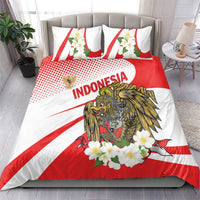 Red and white bedding set on bed: eagle graphic, flower accents, and “Indonesia” text on duvet