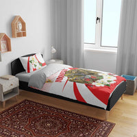 Red and white bedding set with eagle crest, flowers, and “Indonesia” text on comforter and pillows