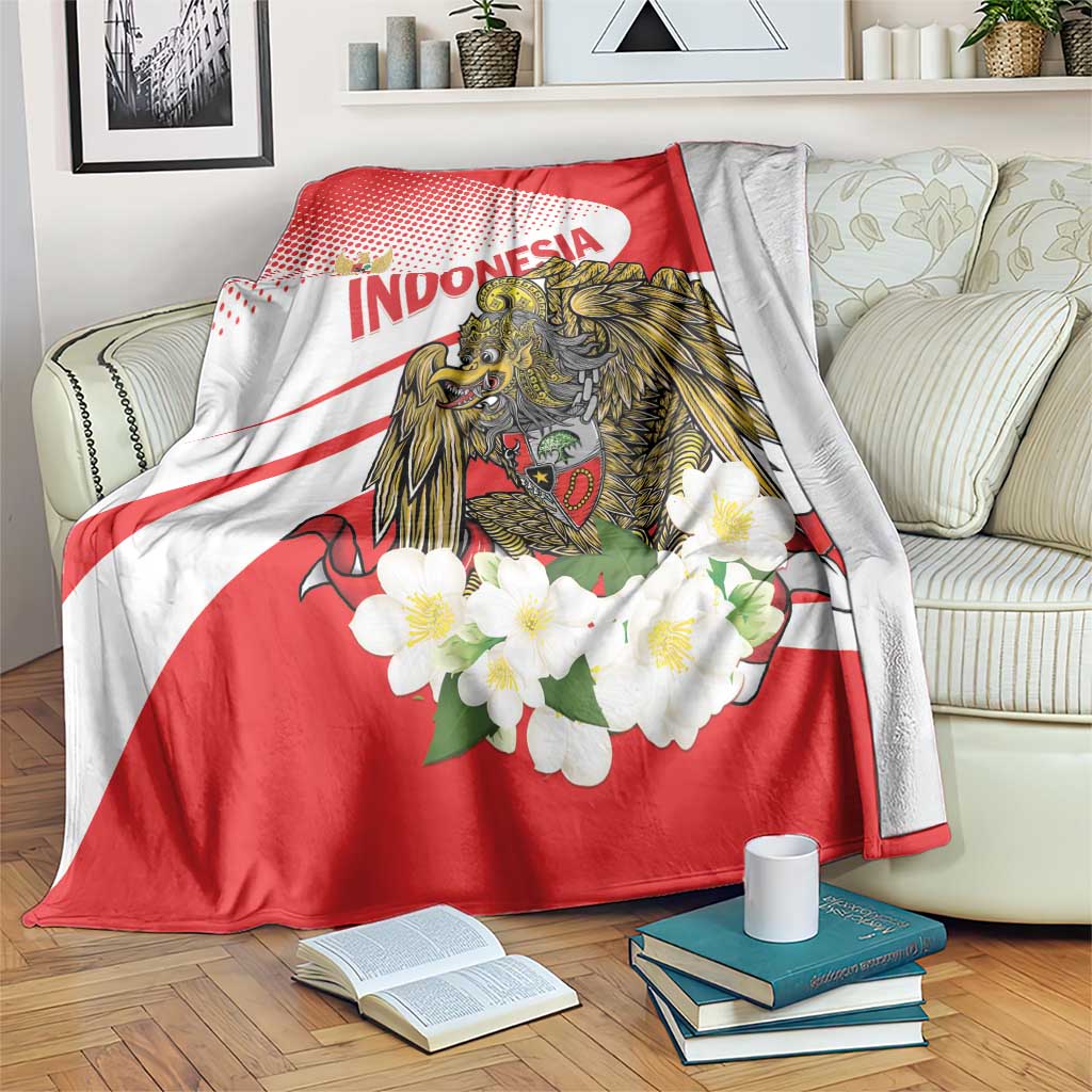 Red and white throw blanket with eagle artwork, 'INDONESIA' lettering, and blossoms