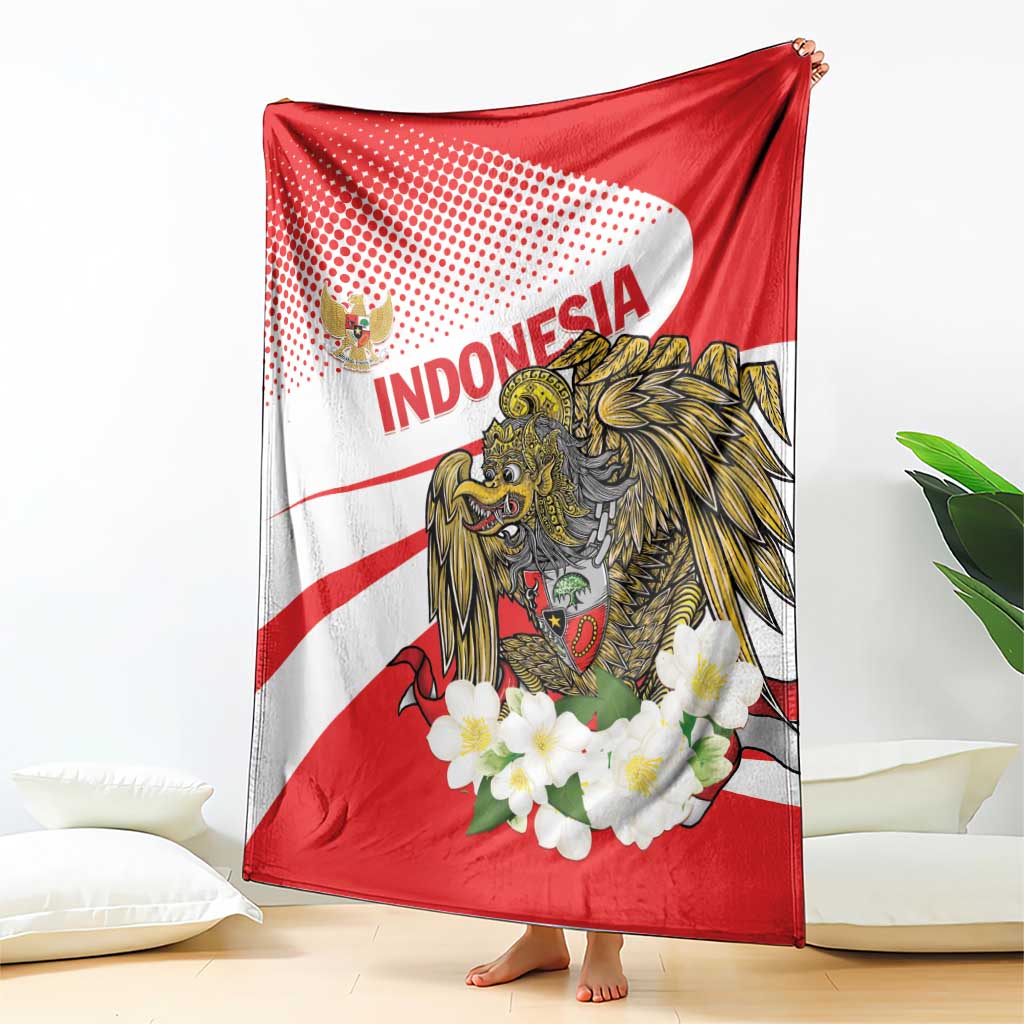 Red and white blanket featuring central eagle, 'INDONESIA' text, and white flowers