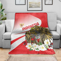 Red and white eagle throw blanket with 'INDONESIA' logo and white blossom border
