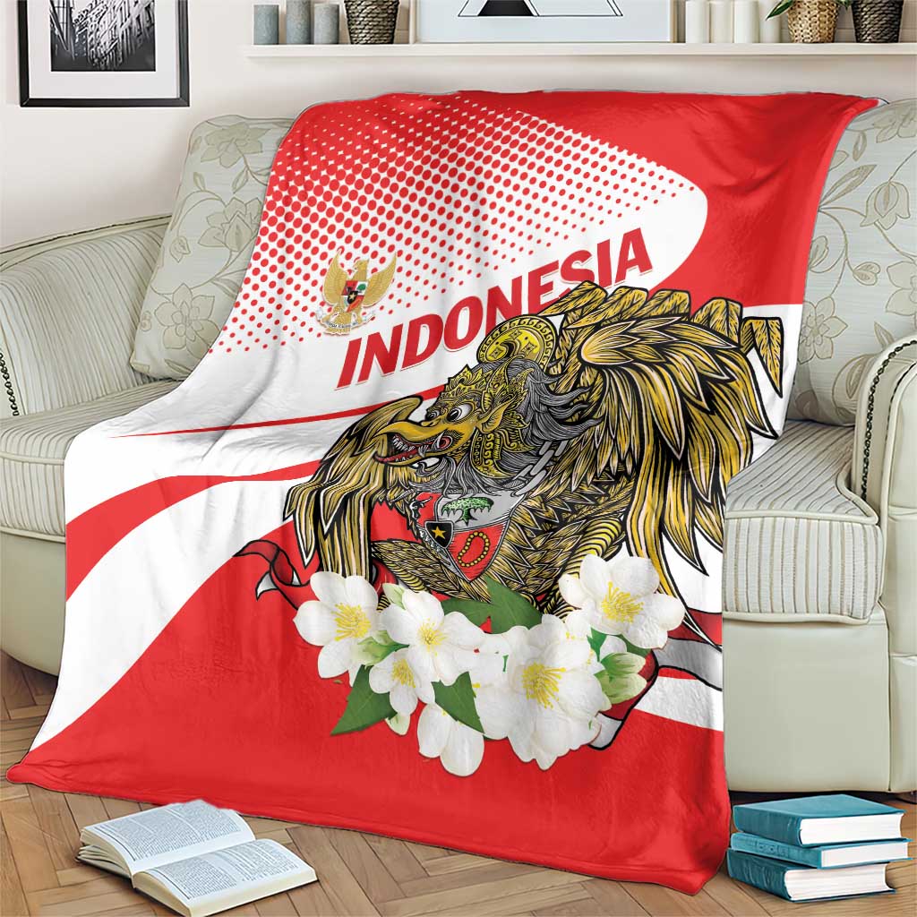 Red and white decorative blanket with eagle crest, 'INDONESIA' text, and white flowers