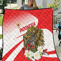 Red and white Indonesia quilt blanket featuring eagle artwork and flower cluster, diamond quilting
