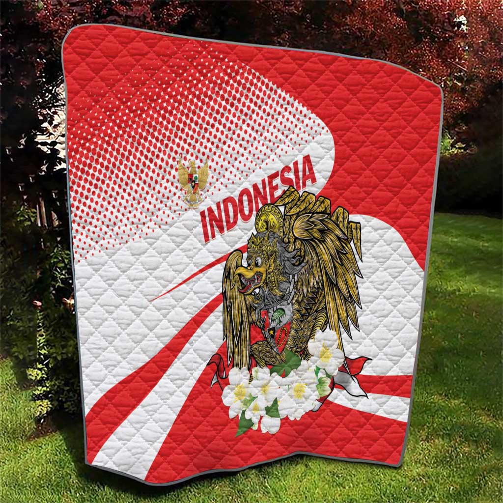 Red and white Indonesia quilt blanket with central eagle graphic and white flower cluster