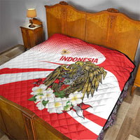 Red and white Indonesia quilt blanket with eagle motif and floral detail, quilted pattern