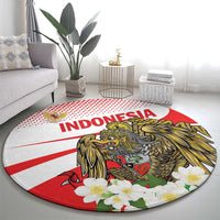 Round red and white Indonesia carpet with eagle and flowers, shown on living room floor
