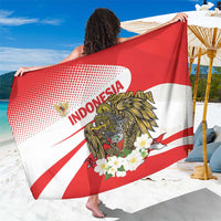 Red and white sarong draped up, showing eagle and “INDONESIA” lettering