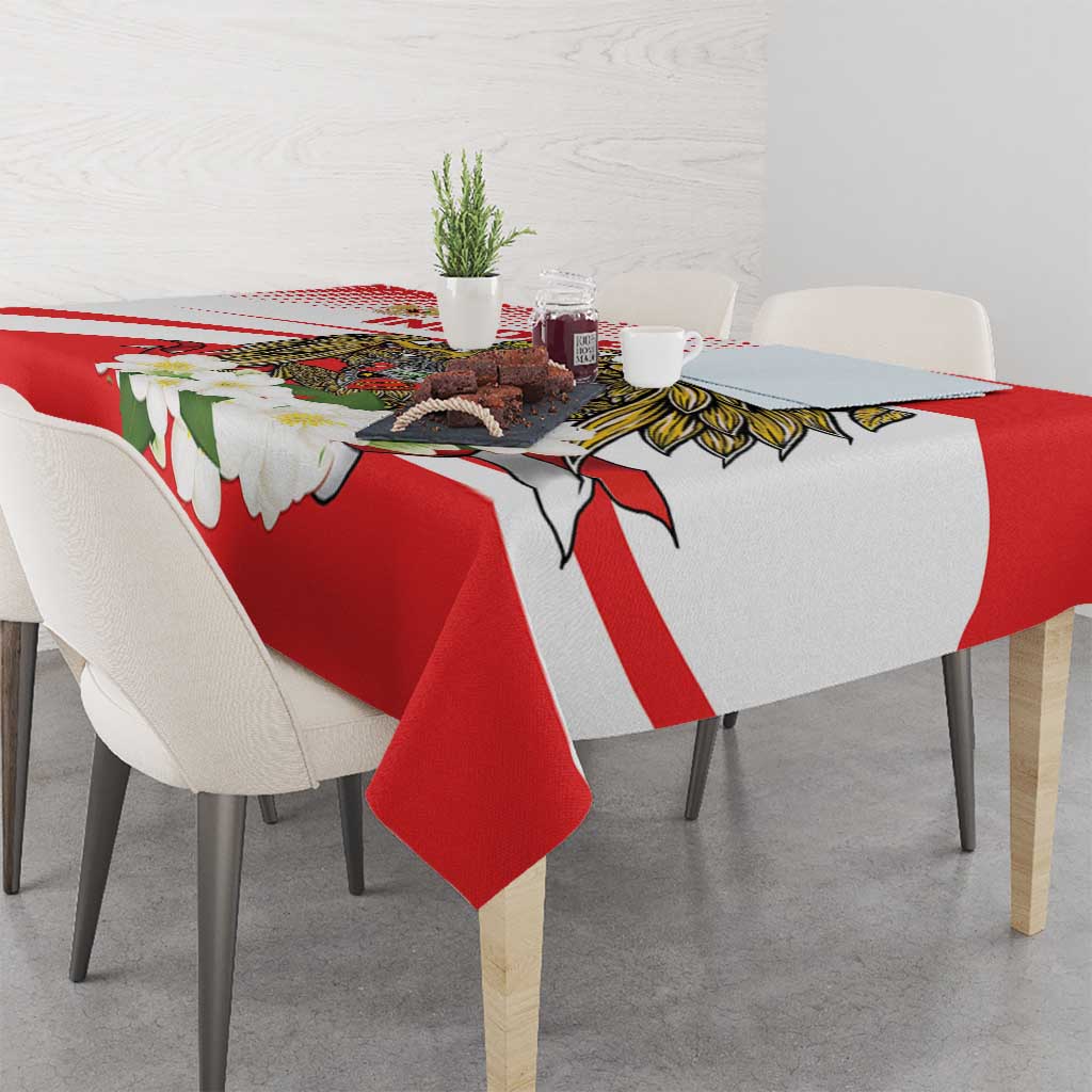 Red tablecloth with white diagonal stripes and white blossom print border