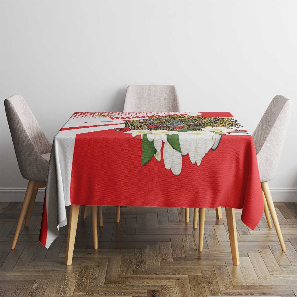 Red tablecloth with white diagonal stripes and large hawk eagle floral print