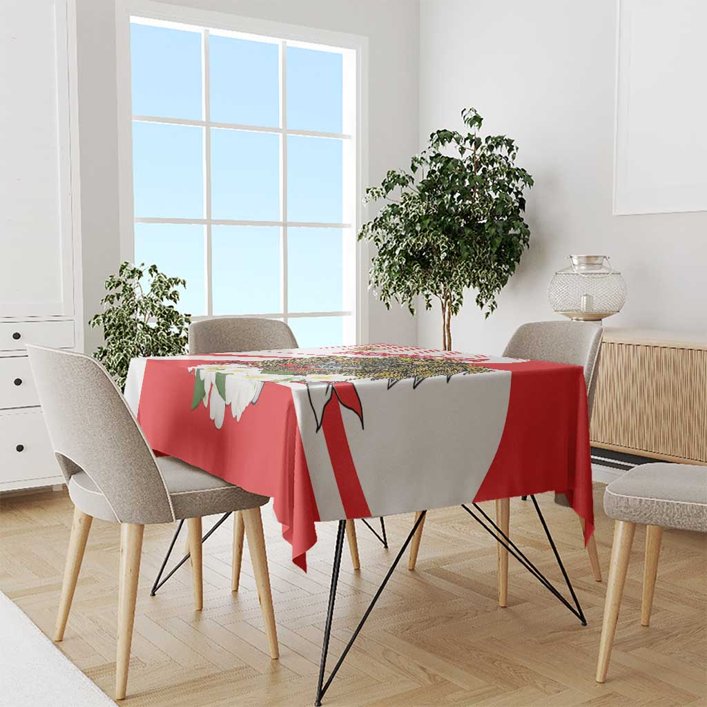 Red tablecloth with white diagonal stripes and green-and-white flower motifs