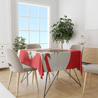 Red tablecloth with white diagonal stripes and green-and-white flower motifs