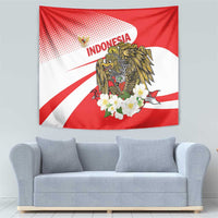 Red and white wall tapestry with gold hawk eagle, white blossoms, and INDONESIA lettering