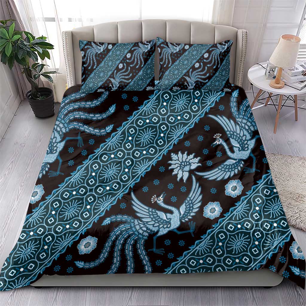 Blue batik-pattern bedding set with duvet and two pillowcases on bed