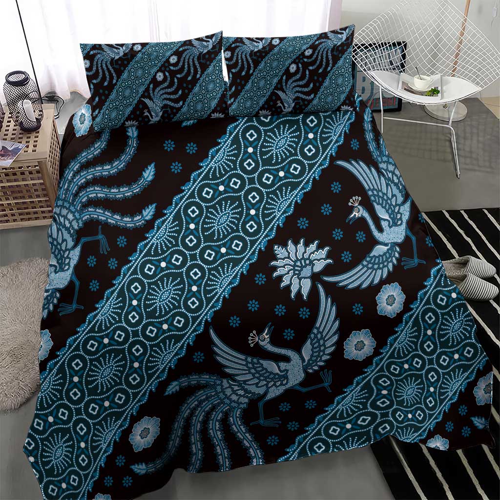 Blue batik-pattern duvet and pillowcases with swirling lines and bird motifs