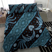 Blue batik-pattern duvet and pillowcases with swirling lines and bird motifs