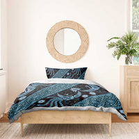 Blue batik-pattern duvet with matching pillowcases for bed