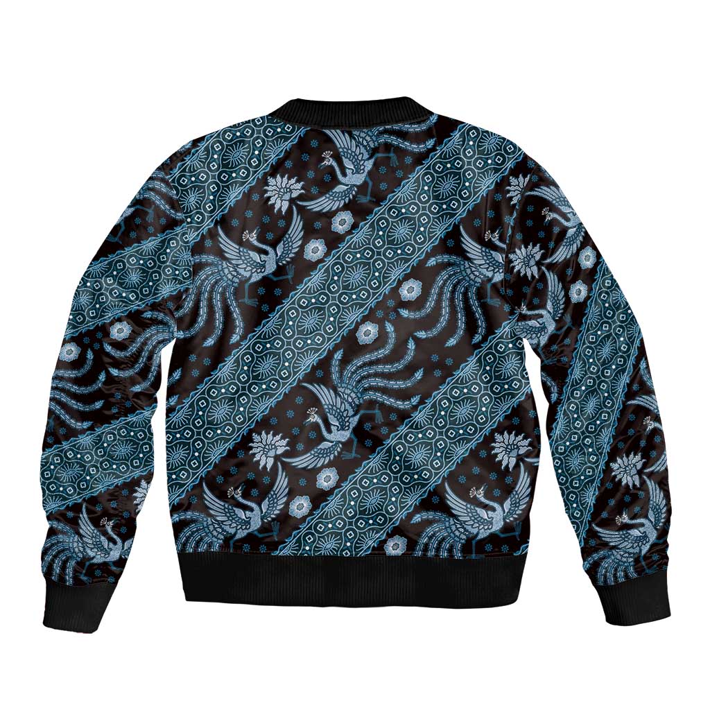 Unisex blue batik-pattern bomber jacket with ribbed black collar, cuffs, and hem