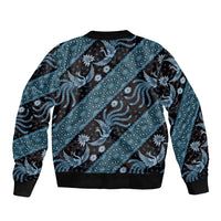 Unisex blue batik-pattern bomber jacket with ribbed black collar, cuffs, and hem