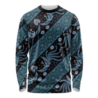 Long-sleeve crewneck batik shirt in dark blue with teal pattern, front view