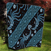 Blue batik pattern quilt close view with dragon figure and detailed geometric border