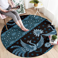 Round area rug, blue batik motif with phoenix-style bird and small floral icons
