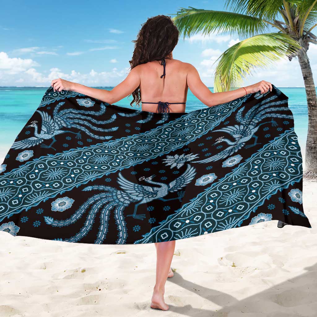 Blue batik sarong with large elephant and wave motifs, flowing wrap