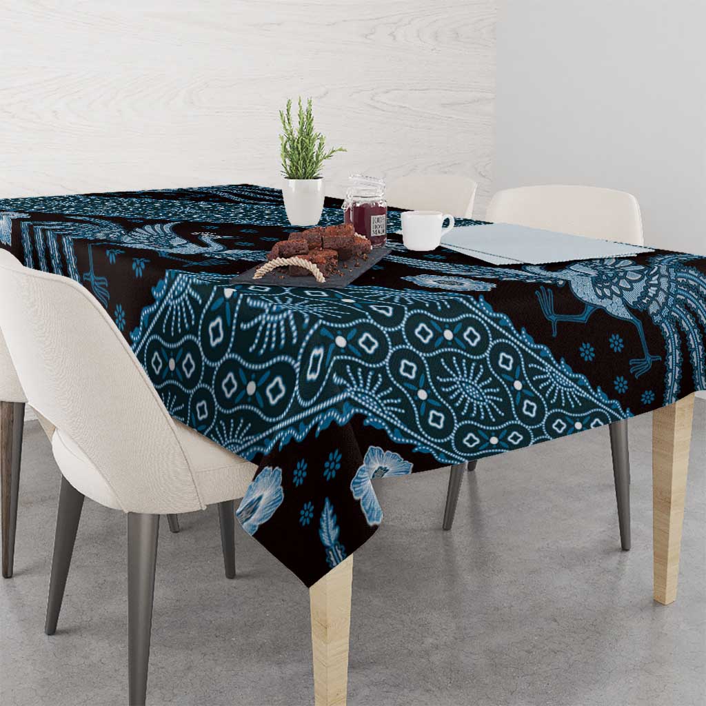 Blue batik-pattern tablecloth with teal-and-navy floral and geometric print across table