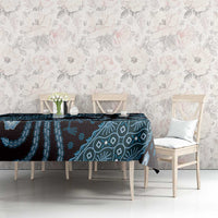 Blue batik-pattern tablecloth spread on table with teal navy motifs in horizontal band