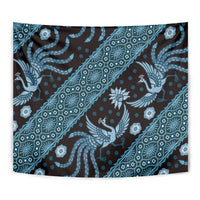 Blue batik pattern tapestry close-up with swirling bird, floral rosettes, and diagonal lines