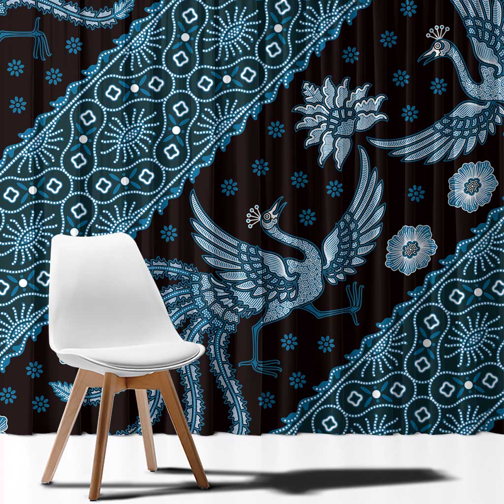 Close-up of blue batik-style fabric with dotted floral and bird motifs