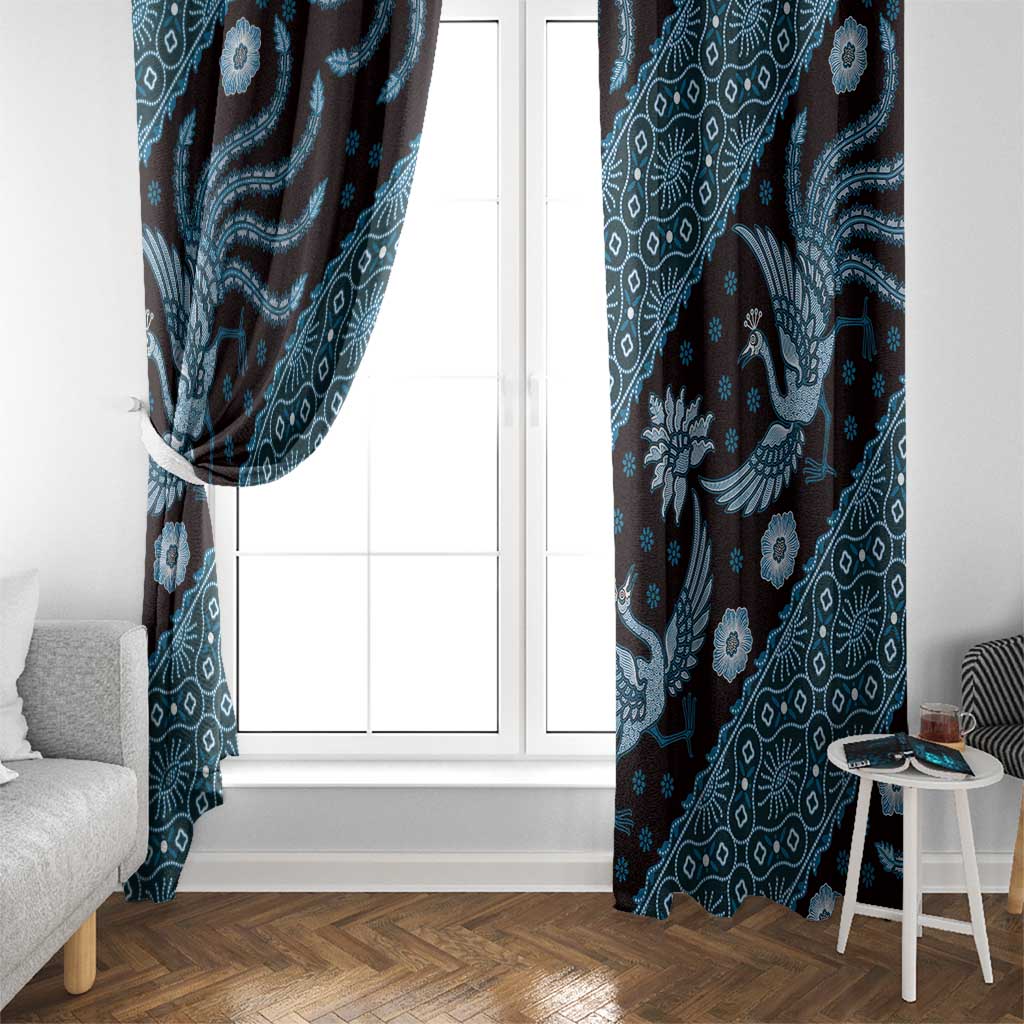 Blue patterned curtain panels beside a white-framed window