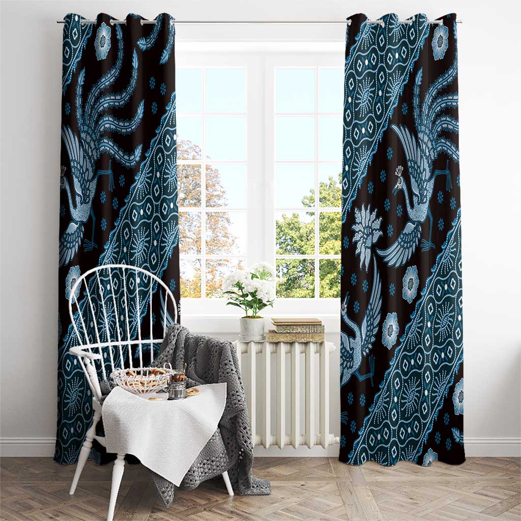 Blue batik-pattern window curtains with hanging loops and ornate animal motifs