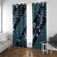 Blue batik patterned curtain pair framing a white door and window