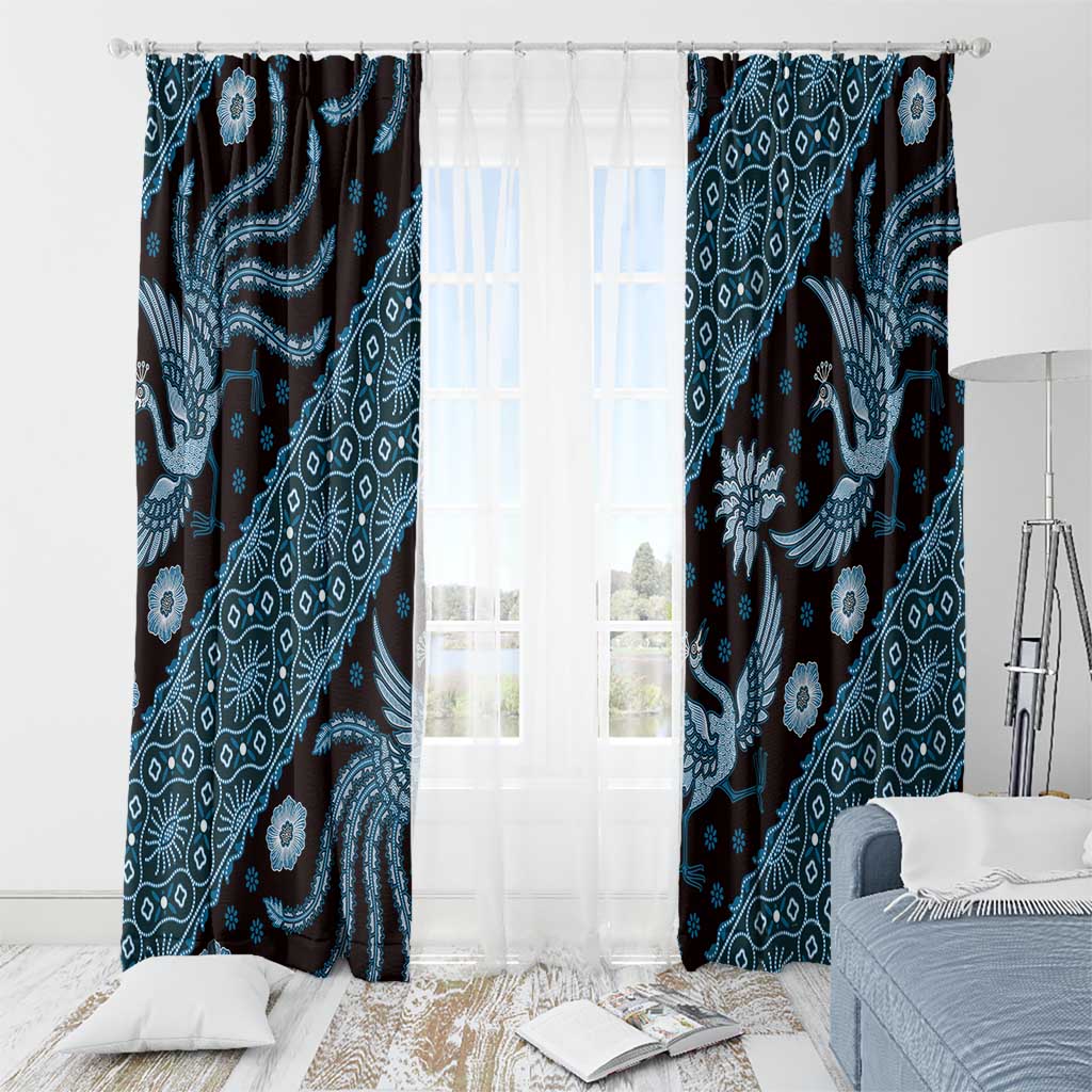 Blue batik-pattern curtain panels with rod top above sheer white panels