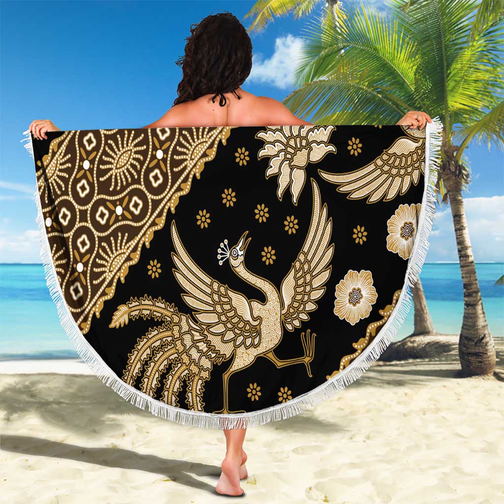 Round batik beach blanket, dark black with gold bird and flower motifs, white fringed edge