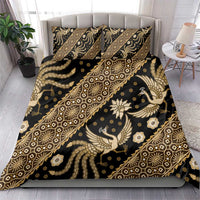 Batik bedding set with dark duvet cover and gold batik motifs plus two pillow covers