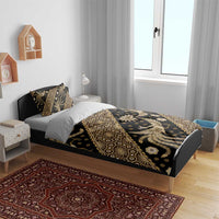Batik bedding set on bed with dark duvet cover and gold batik pattern, two pillow covers