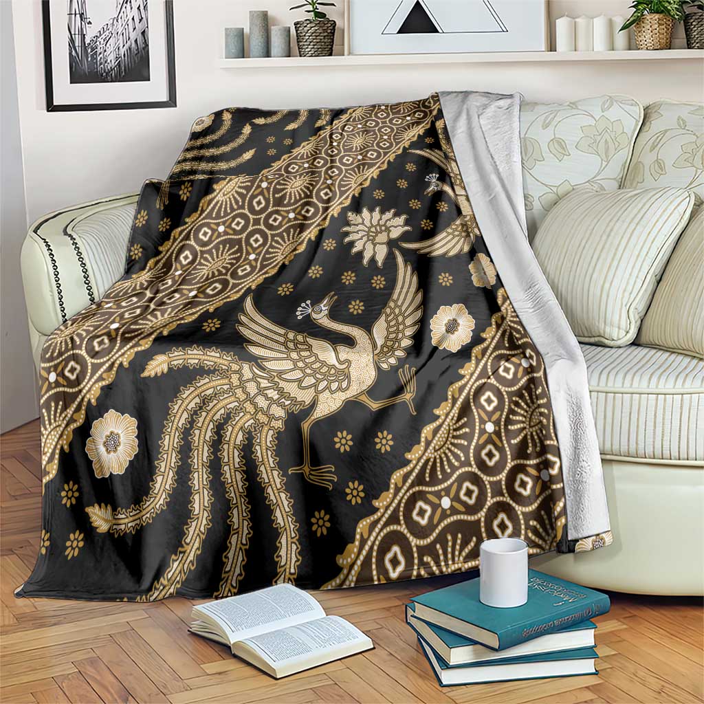 Gold-toned batik patterned throw blanket with dark base and ornate bird motifs